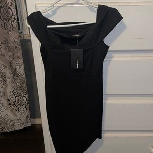 Fashion Nova do or die dress never worn, still new with tags size large, black